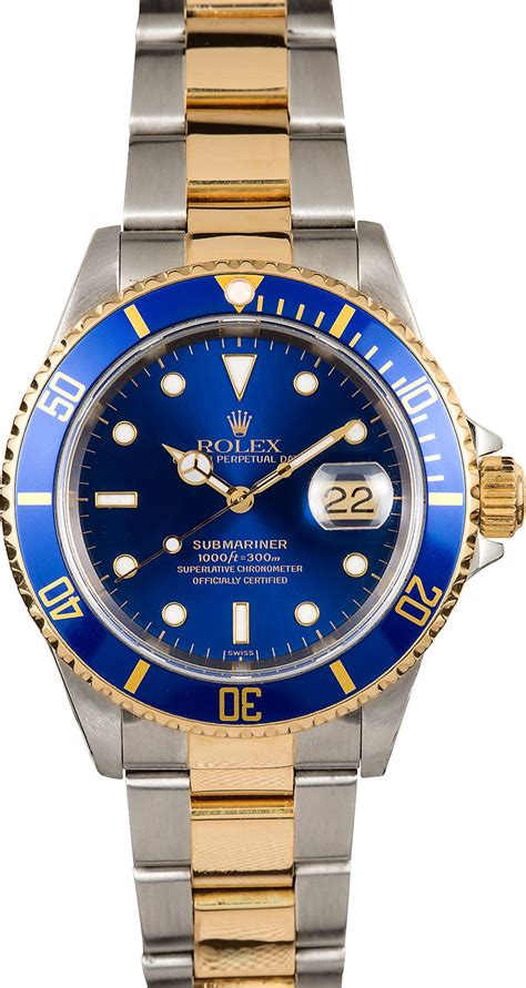 rolex with a blue face.